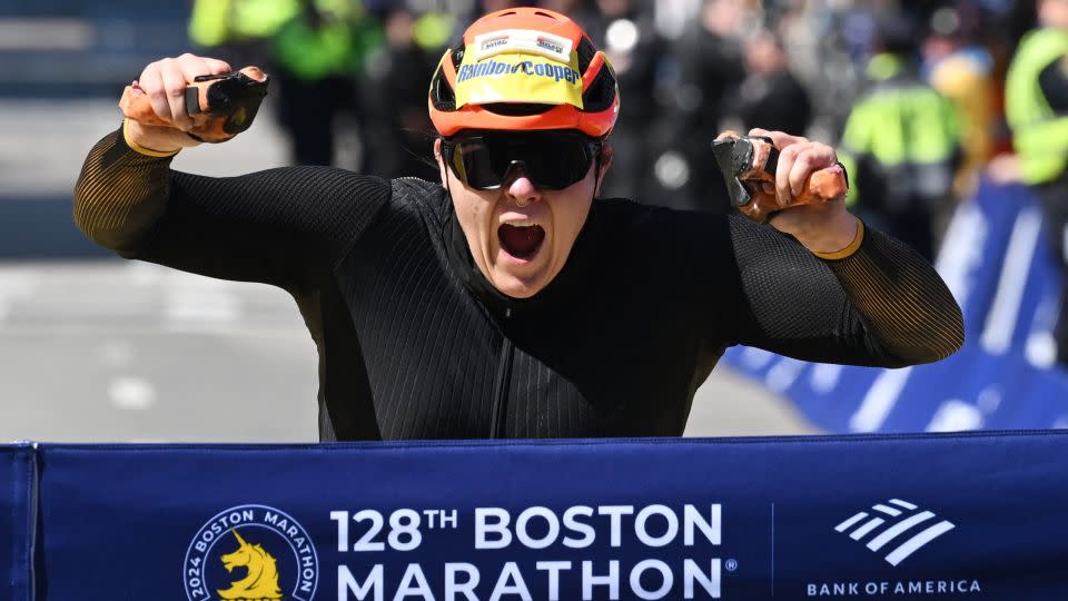 Rainbow-Cooper crosses the finish line to win the women's wheelchair race. - Ken McGagh/Reuters