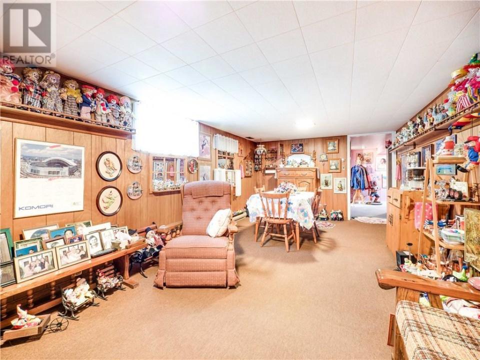 <p>In the basement, you’ll find plenty of space for relaxing, plus custom display units for the clowns. (Zoocasa) </p>