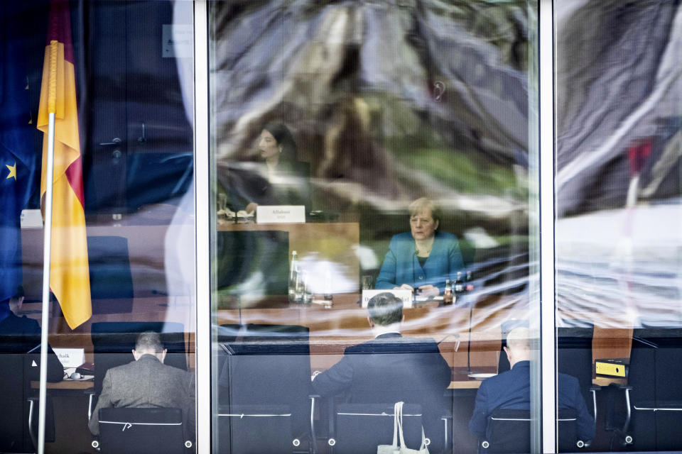 German Chancellor Angela Merkel sits as a witness before the Bundestag's investigative committee on the Wirecard AG accounting scandal in Berlin, Germany, Friday, April 23, 2021. (Michael Kappeler/dpa via AP)