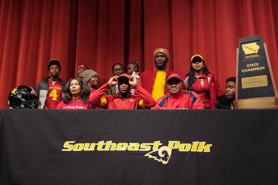 Southeast Polk senior Abu Sama sits for a photo with his family after signing his letter of intent to play at Iowa State during a signing day ceremony on Wednesday.
