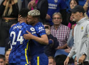 Chelsea's Reece James, left, leaves the field after sustaining an injury during the English Premier League soccer match between Chelsea and Manchester City at Stamford Bridge Stadium in London, Saturday, Sept. 25, 2021. (AP Photo/Alastair Grant)