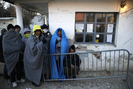 Migrants wait inside a registration camp in Presevo, Serbia, January 20, 2016. REUTERS/Marko Djurica