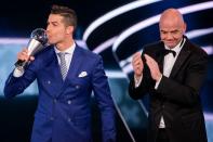 <p>Gianni Infantino applauds winner Cristiano Ronaldo </p>