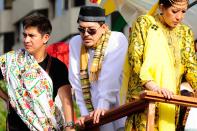 Internationally acclaimed film director, Brillante Mendoza is seen riding the float of his MMFF 2012 entry "Thy Womb" during the 2012 Metro Manila Film Festival Parade of Stars on 23 December 2012. (Angela Galia/NPPA Images)