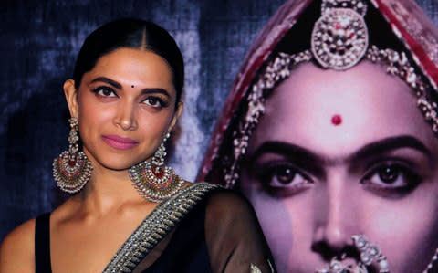 Indian Bollywood actress Deepika Padukone poses for a photograph during a promotional event for the forthcoming Hindi film 'Padmavati - Credit: STR/AFP/Getty