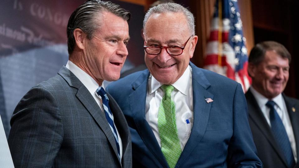 PHOTO: Senate Majority Leader Chuck Schumer and Republican Senator from Indiana Todd Young talk prior to a press conference in the US Capitol, in Washington, D.C., on May 15, 2024. (Shawn Thew/EPA via Shutterstock)