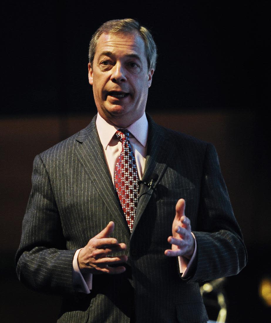 The UK Independence Party leader, Nigel Farage, delivers a speech on stage at the UKIP Spring Conference 2014 held at the Riviera International Conference Centre, Torquay, England, Saturday March 1, 2014. The UK Independence Party claims its support is growing throughout Britain ahead of European Parliament elections in May. The upstart party led by Nigel Farage hopes to capitalize on anti-European Union and anti-immigrant sentiments. At public meetings at the end of its two-day conference in southwest England Saturday, Farage said UKIP is winning voters tired of the political elite. (AP Photo/PA, Ben Birchall) UNITED KINGDOM OUT NO SALES NO ARCHIVE