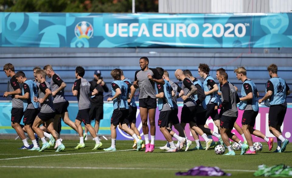 Denmark's players exercise during a team training session in Helsingor, Denmark, Wednesday, June 16, 2021 the day before the Euro 2020 soccer championship group B match between Denmark and Belgium. (AP Photo/Martin Meissner)