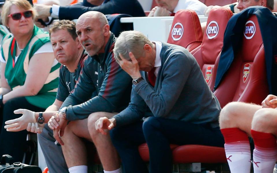 Arsene Wenger cannot watch during his team's eventual 4-1 defeat of West Ham on Sunday - AFP