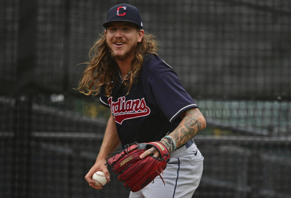 Cleveland Indians starting pitcher Mike Clevinger warms up in the bullpen before a simulated baseball game at Progressive Field, Friday, July 10, 2020, in Cleveland. (AP Photo/David Dermer)