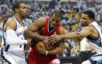 MEMPHIS, TN - MAY 13: Chris Paul #3 of the Los Angeles Clippers drives between Mike Conley #11 and Rudy Gay #22 of the Memphis Grizzlies in Game Seven of the Western Conference Quarterfinals in the 2012 NBA Playoffs at FedExForum on May 13, 2012 in Memphis, Tennessee. NOTE TO USER: User expressly acknowledges and agrees that, by downloading and or using this photograph, User is consenting to the terms and conditions of the Getty Images License Agreement (Photo by Kevin C. Cox/Getty Images)