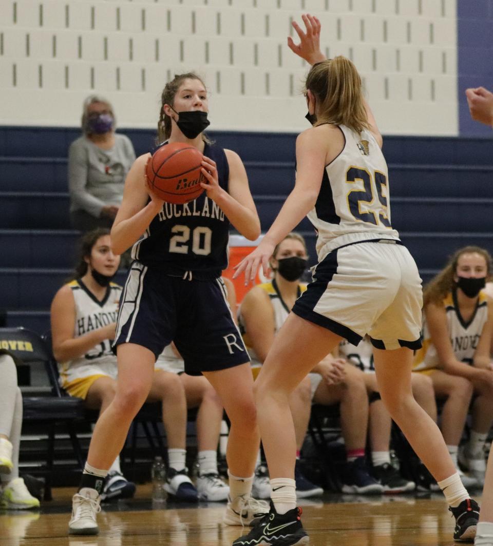 Rockland's Julia Elie faces defensive pressure in a game against Hanover on Friday, December 10, 2021.