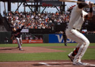 Atlanta Braves starting pitcher Max Fried, left, delivers to San Francisco Giants' Kris Bryant, right, during the first inning of a baseball game, Sunday, Sept. 19, 2021, in San Francisco. (AP Photo/D. Ross Cameron)