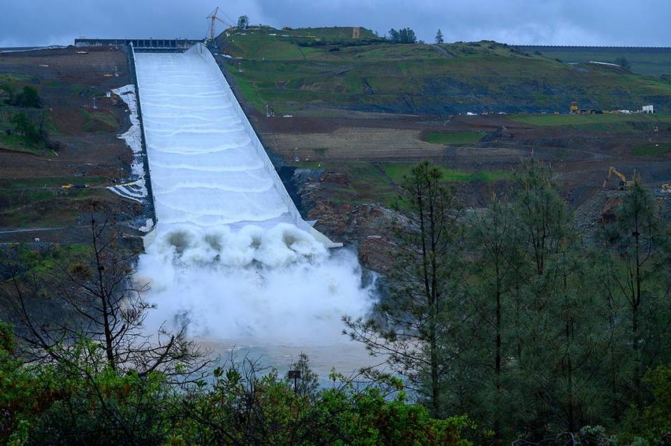 Water flows down the new spillway at Oroville Dam on Tuesday, April 2, 2019 in Oroville.