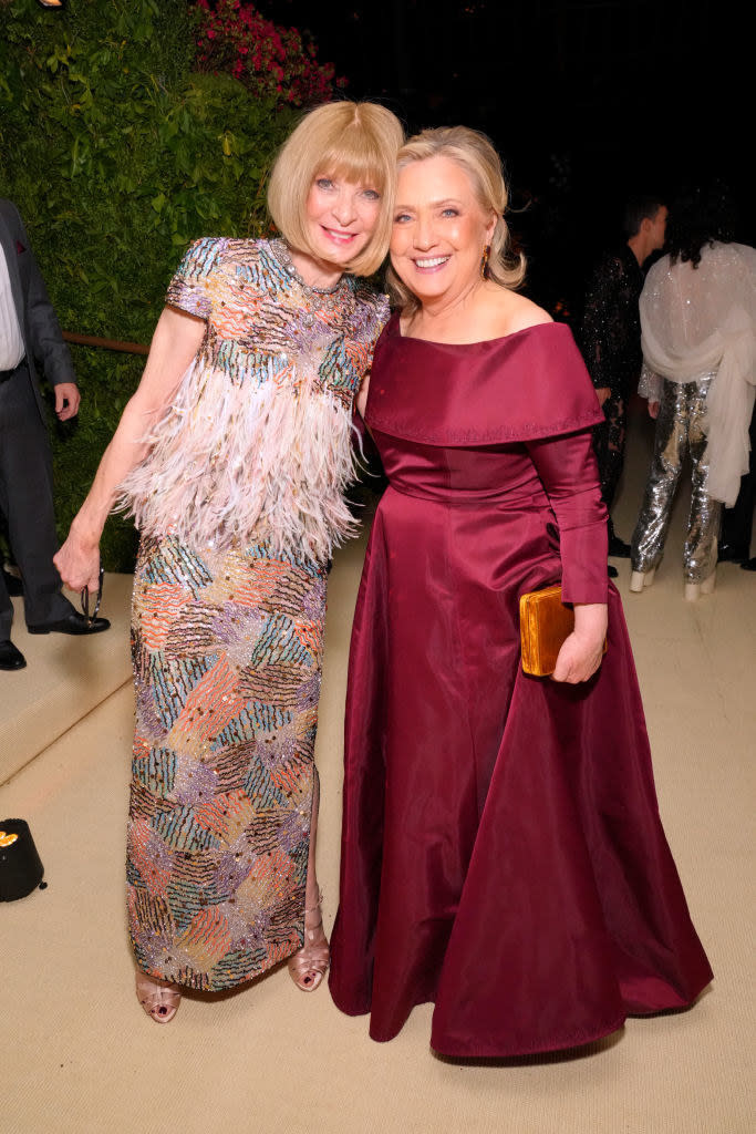 Anna Wintour and Hillary Clinton standing together and smiling at a formal event