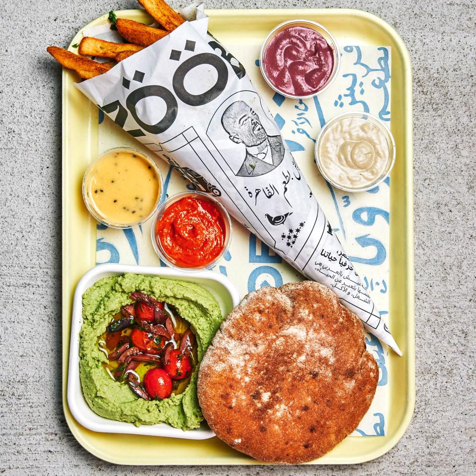 All my friends are at Zooba: za'atar fries, baladi bread, and bessara (fava bean dip).