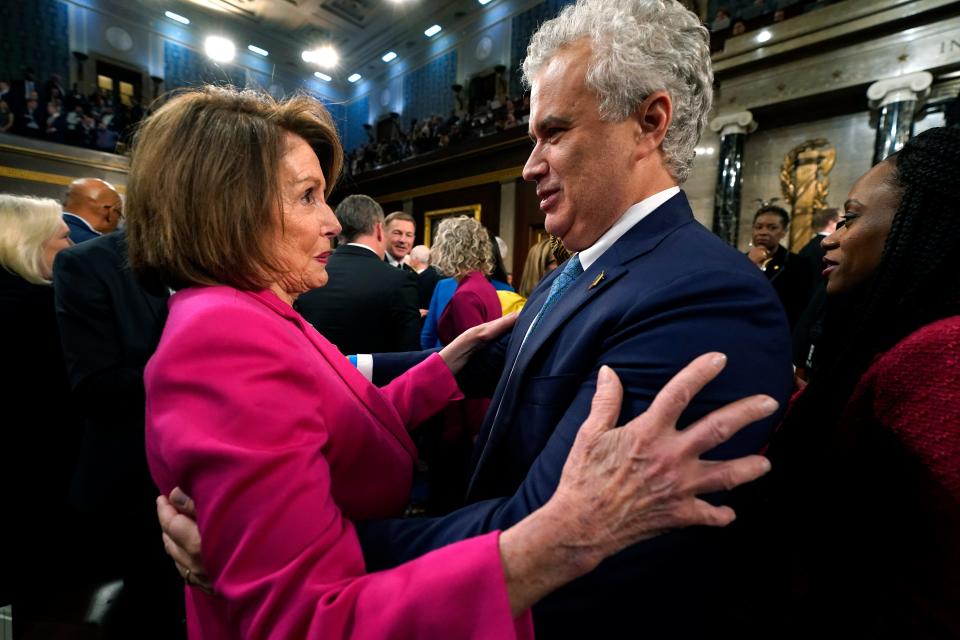 Rep. Nancy Pelosi, D-Calif., talks with White House chief of staff Jeff Zients before President Joe Biden delivers the State of the Union address to a joint session of Congress.
