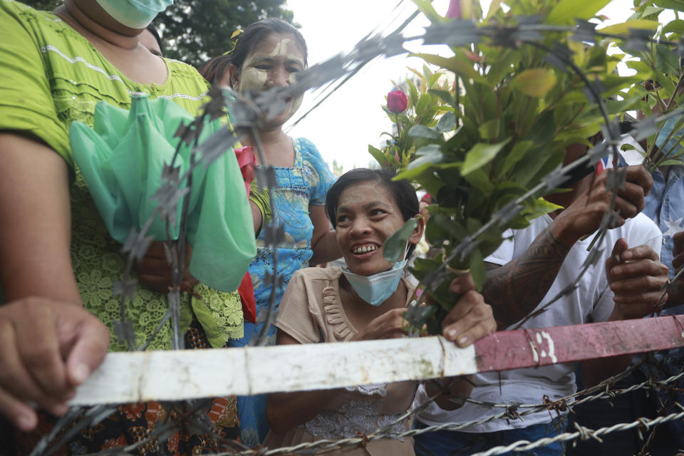 Family members and friends wait to welcome released prisoners outside the Insein Prison Tuesday, Oct. 19, 2021, in Yangon, Myanmar. Myanmar's government on Monday announced an amnesty for thousands of prisoners arrested for taking part in anti-government activities following February's seizure of power by the military. (AP Photo)