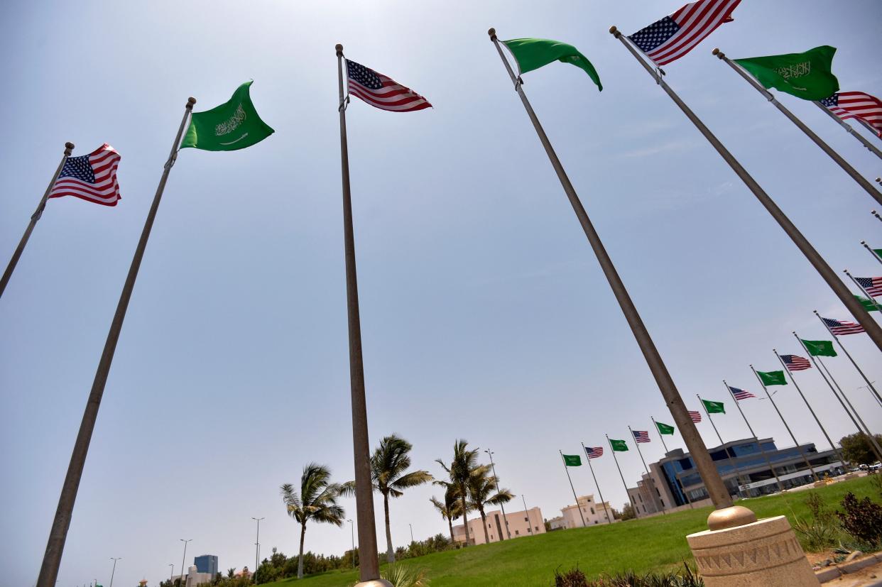 Saudi and US flags line the King Abdulaziz Road in the Saudi Red Sea port city of Jeddah, on July 14, 2022, ahead of a visit by US President Joe Biden.