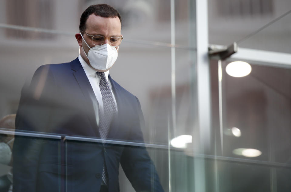 German Health Minister Jens Spahn leaves after a news conference on the coronavirus pandemic and the COVID-19 disease, in Berlin, Germany, Friday, June 18, 2021. Germany’s health minister says the country has now given a first coronavirus vaccine shot to more than half of its population. (Hannibal Hanschke/Pool via AP)