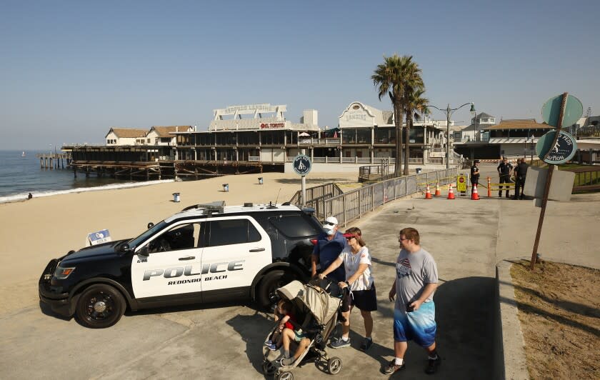 REDONDO BEACH, CA - AUGUST 26: Redondo Beach Police have closed access to the Redondo Beach Pier Thursday morning after two people were injured and a suspect is dead in a officer involved shooting Wednesday night. Officers responded to a shooting and found two victims. Officers located a suspect and fired at him killing him at the scene. Redondo Beach Pier on Thursday, Aug. 26, 2021 in Redondo Beach, CA. (Al Seib / Los Angeles Times).