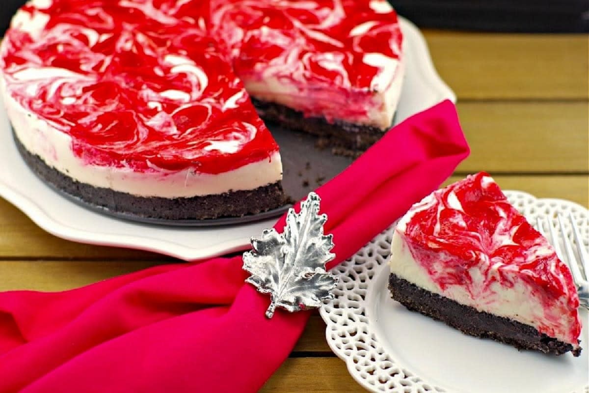 <p>Food Meanderings</p><p>A lighter cheesecake, boasting dark chocolate Oreo cookie crust, coupled with a rich, creamy white chocolate and red rhubarb-strawberry marble filling. </p><p><strong>Get the recipe: </strong><a href="https://foodmeanderings.com/no-bake-light-rhubarb-cheesecake-red-white/" rel="nofollow noopener" target="_blank" data-ylk="slk:No-Bake Strawberry Rhubarb Cheesecake;elm:context_link;itc:0;sec:content-canvas" class="link rapid-noclick-resp"><strong>No-Bake Strawberry Rhubarb Cheesecake</strong></a></p>