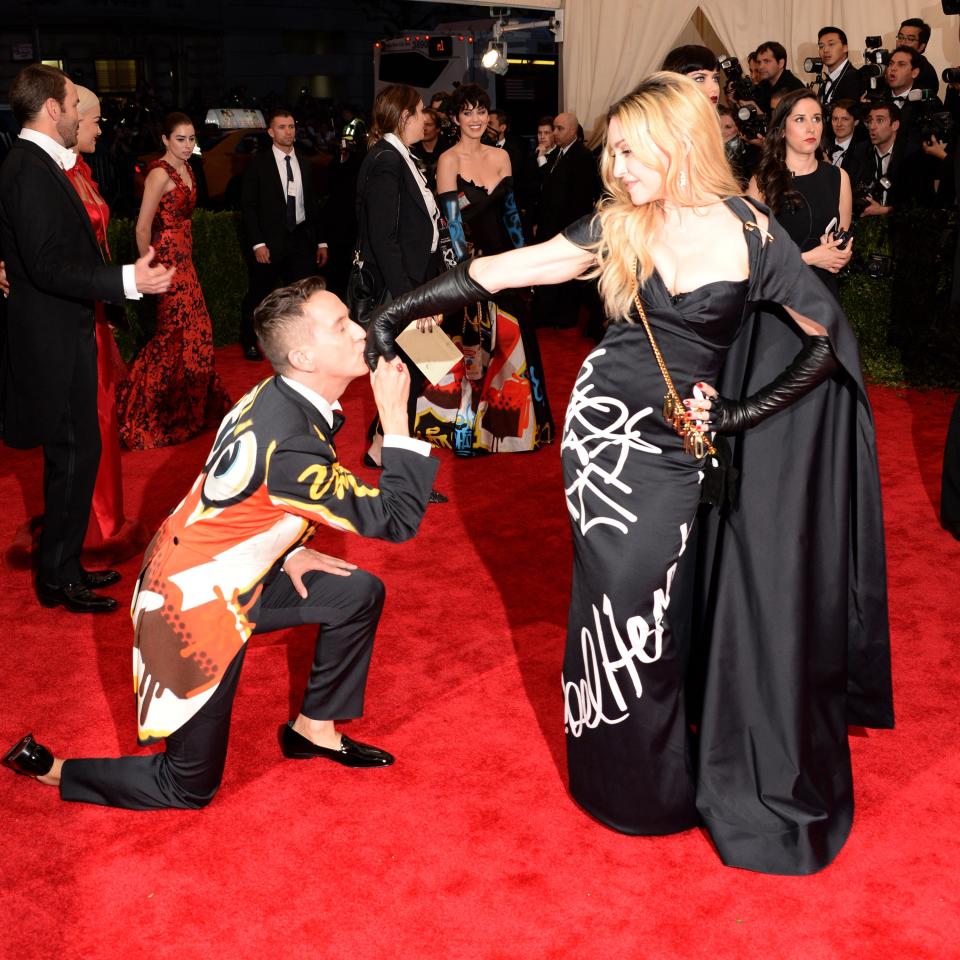 Jeremy Scott bows down to Madonna at the 2015 Met gala.