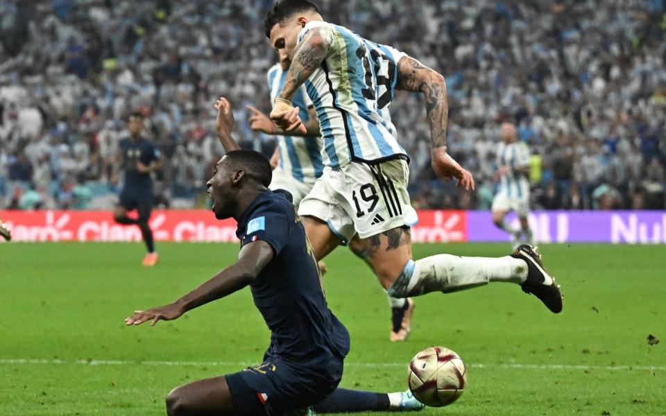 Argentina's Nicolas Otamendi concedes a penalty against France's Randal Kolo Muani - Reuters