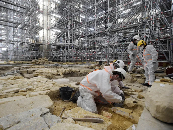 Archeologists excavate the floor at Notre Dame Cathedral