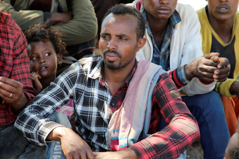 Ethiopian migrants gather to protest their treatment in the war-torn country during a sit-in outside a compound of United Nations organizations in the southern port city of Aden