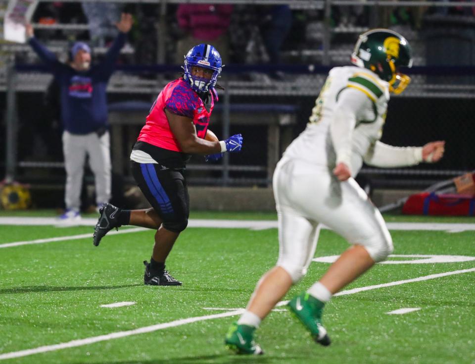 Middletown's Justin McGill heads for the end zone with a pick-six late in the fourth quarter of the Cavs' 35-10 win against Saint Mark's at Cavalier Stadium, Friday, Nov. 3, 2023.