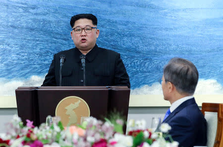 North Korean leader Kim Jong Un speaks at the truce village of Panmunjom inside the demilitarized zone separating the two Koreas, South Korea, April 27, 2018. Korea Summit Press Pool/Pool via Reuters