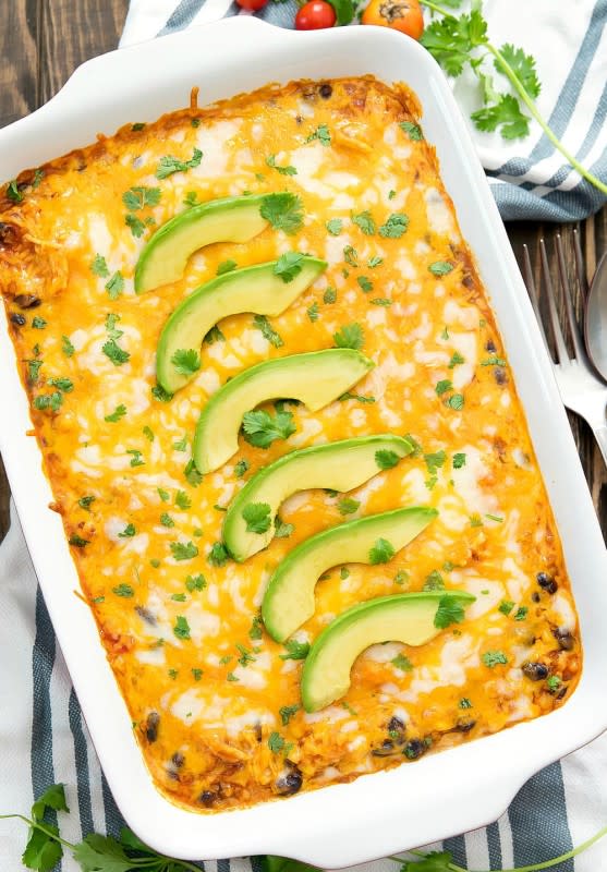 This cheesy and flavorful chicken enchilada rice casserole is made with cauliflower rice. It’s an easy dish that comes together in under an hour.<p><strong>Get the recipe: <a href="https://kirbiecravings.com/chicken-enchilada-cauliflower-rice-casserole/" rel="sponsored" target="_blank" data-ylk="slk:Chicken Enchilada Cauliflower Rice Casserole;elm:context_link;itc:0;sec:content-canvas" class="link ">Chicken Enchilada Cauliflower Rice Casserole</a></strong></p>