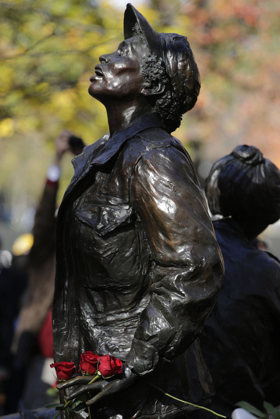 Vietnam Womens Memorial adorned with roses in seen on Veterans Day in Washington