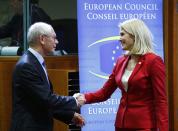 Denmark's Prime Minister Helle Thorning Schmidt (R) is welcomed by European Council President Herman Van Rompuy (L) at a European Union leaders summit in Brussels October 24, 2013. German and French accusations that the United States has run spying operations in their countries, including possibly bugging Chancellor Angela Merkel's mobile phone, are likely to dominate a meeting of EU leaders starting on Thursday. The two-day Brussels summit, called to tackle a range of social and economic issues, will now be overshadowed by debate on how to respond to the alleged espionage by Washington against two of its closest European Union allies. REUTERS/Yves Herman (BELGIUM - Tags: POLITICS)