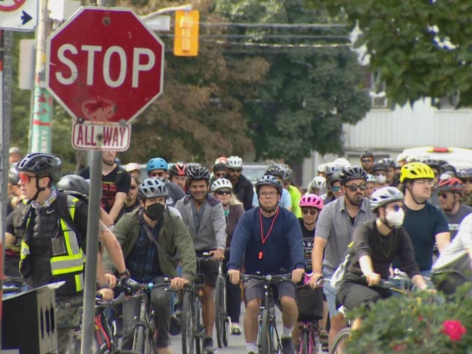 A group of cyclists ride in Toronto, calling for the full return of ActiveTO and safer streets for pedestrians and cyclists.  (Prasanjeet Choudhury/CBC - image credit)