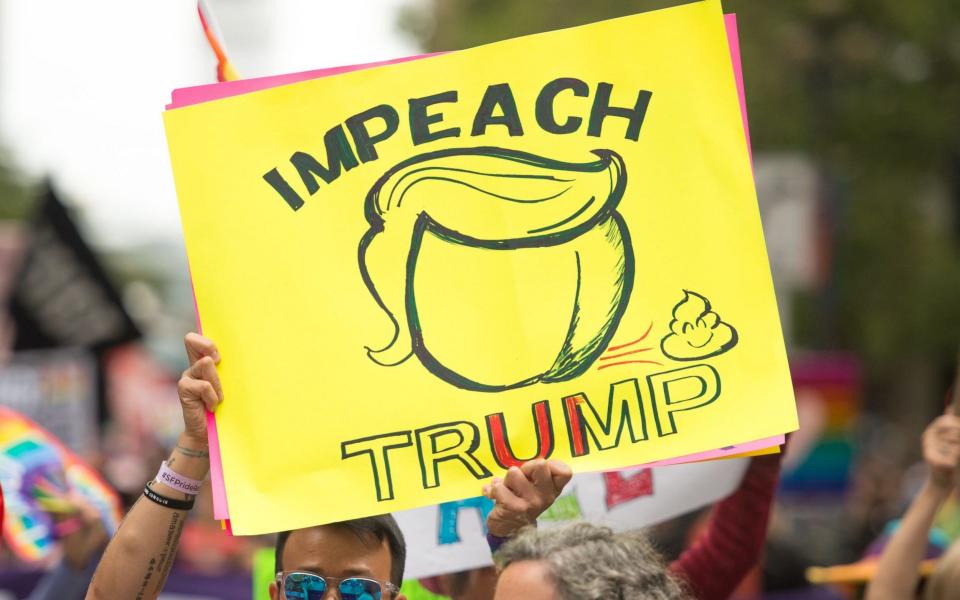 Anti-Trump protesters march in the San Francisco Pride parade in San Francisco - Credit: AFP