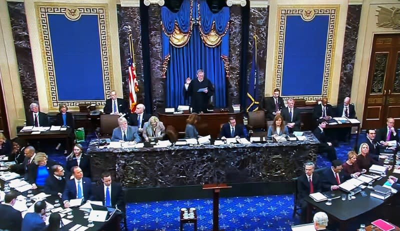 Chief Justice Roberts swears in final senator for impeachment trial of President Trump at the U.S. Capitol in Washington