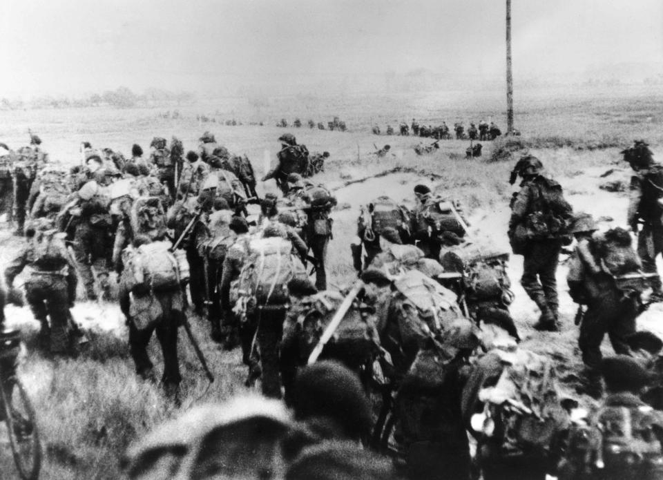 This file photo taken on June 6, 1944 shows the Allied forces soldiers landing in Normandy. - In what remains the biggest amphibious assault in history, some 156,000 Allied personnel landed in France on June 6, 1944. An estimated 10,000 Allied troops were left dead, wounded or missing, while Nazi Germany lost between 4,000 and 9,000 troops, and thousands of French civilians were killed. The 75th anniversary of the D-day landings will fall on June 6, 2019.