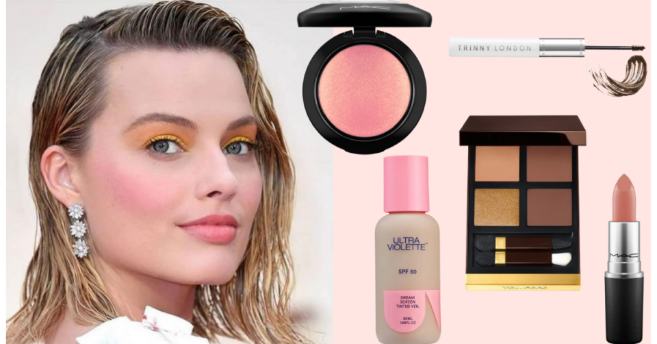 A woman with shoulder length-hair and triple starburst earrings wears pink-toned makeup and is pictured next to a selection of makeup products, including blush, mascara, foundation, eyeshadow and lipstick.