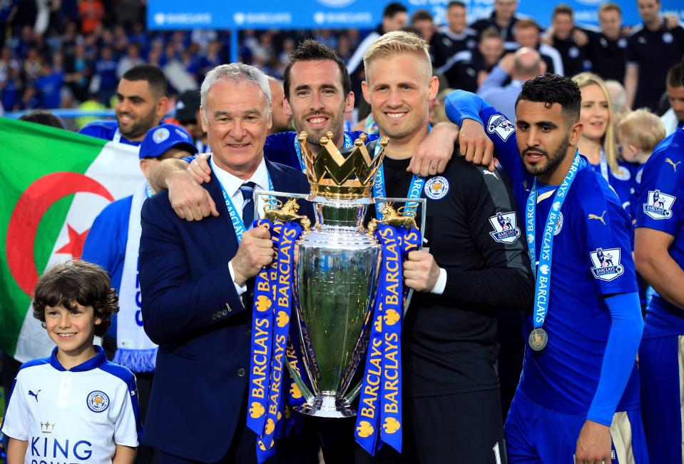 Claudio Ranieri (left), Christian Fuchs (centre), goalkeeper Kasper Schmeichel and Riyad Mahrez (right) with the Premier League trophy