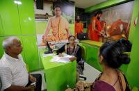 An Ayurveda doctor collects her patient's history before examining her at a Patanjali Ayurved clinic in Ahmedabad