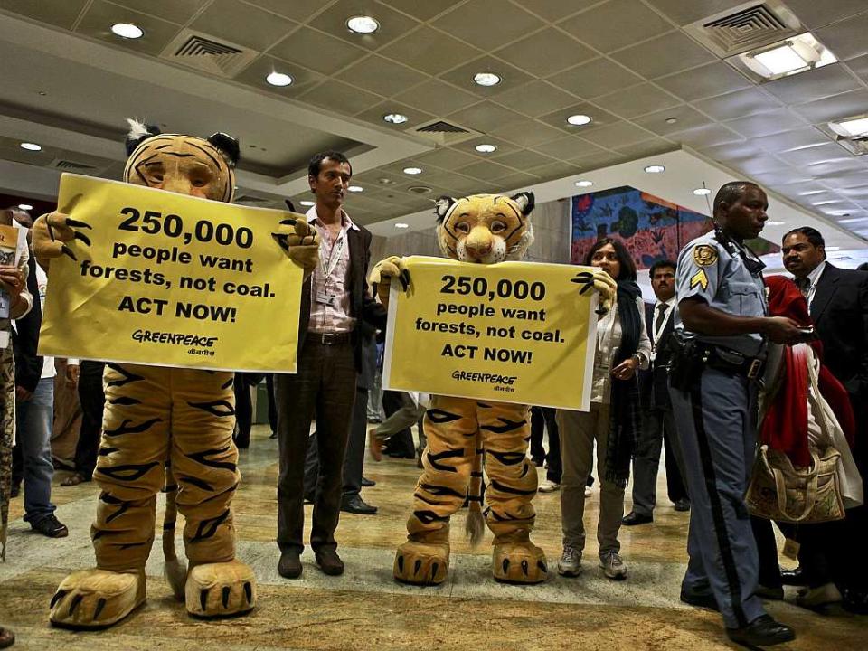 Brikesh Singh and the tiger mascots at the CBD during the PM’s keynote address to the High Level Segment.