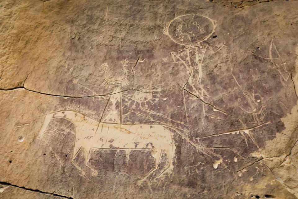 <em>Horse and rider petroglyph at the Tolar site, located in Sweetwater County, Wyoming. This depiction was likely carved by ancestral Comanche or Shoshone people. (Photo/Pat Doak)</em>