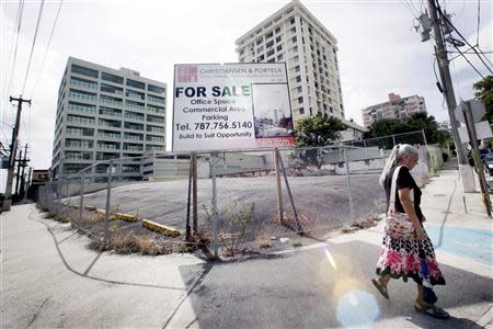 A billboard announces office space and parking for sale in San Juan, August 31, 2013. REUTERS/Alvin Baez