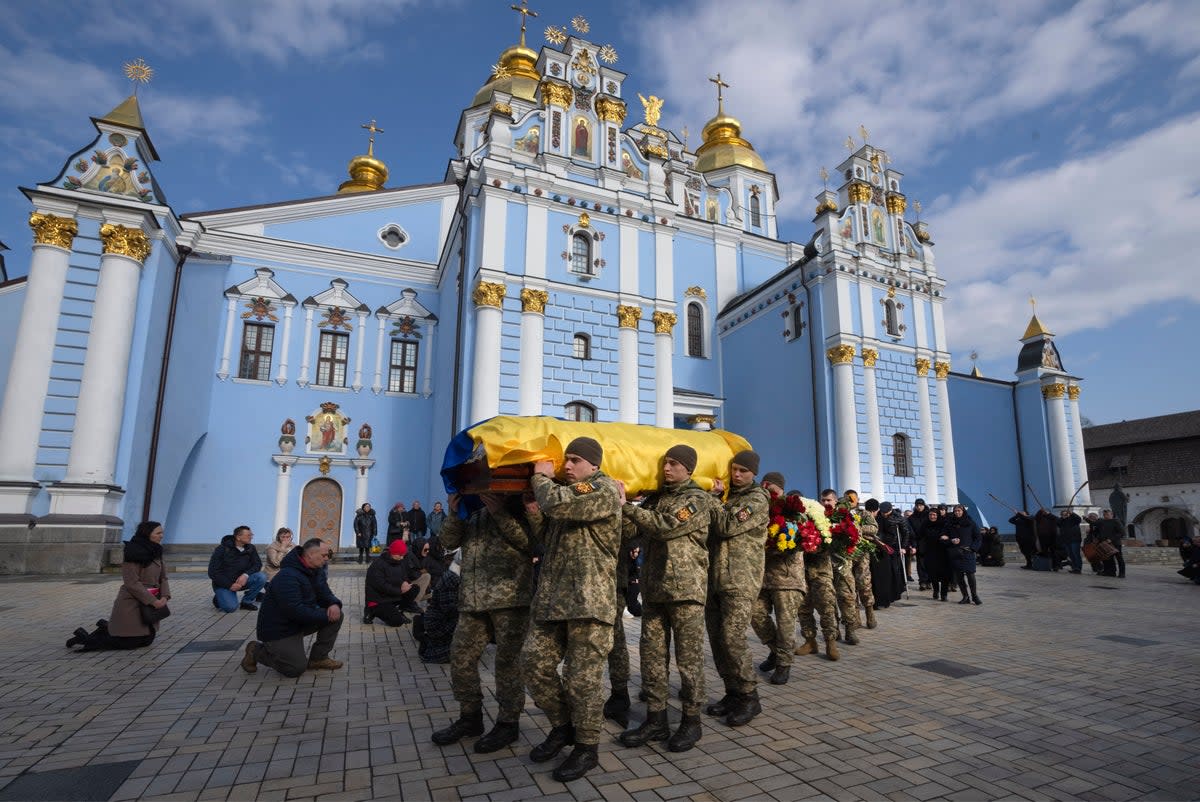 A funeral is completed in Kyiv for fallen servicemen (Copyright 2023 The Associated Press. All rights reserved.)
