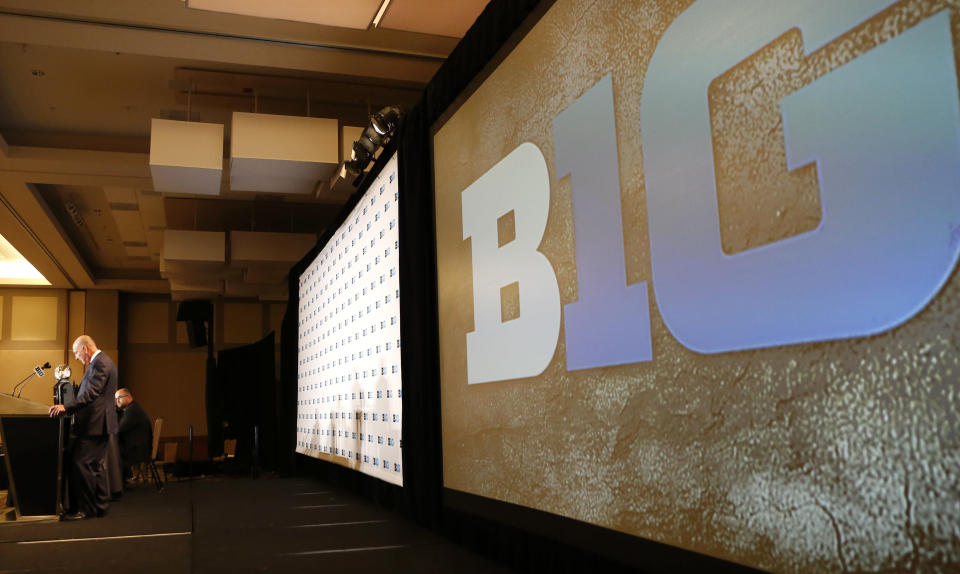 Big Ten commissioner Jim Delany, left, speaks to the media at the Big Ten NCAA college football media days, Tuesday, July 26, 2016 in Chicago. (AP Photo/Tae-Gyun Kim)