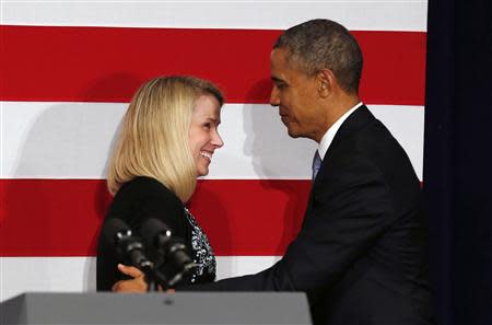 U.S. President Barack Obama is introduced to speak by Yahoo CEO Marissa Mayer at a DNC fund raiser in San Jose, California May 8, 2014. REUTERS/Kevin Lamarque