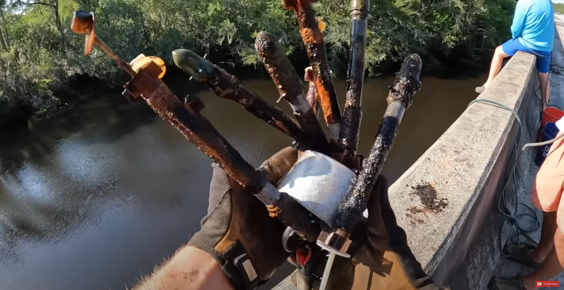 The magnet fishers reeled in stray rockets, a tank shell, navigation equipment and other items from the river.