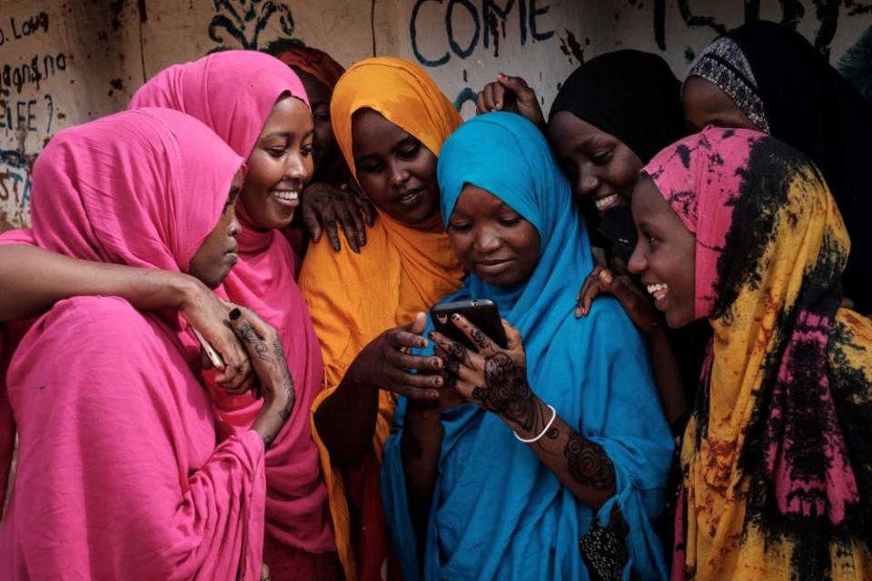 Somali women using a smartphone